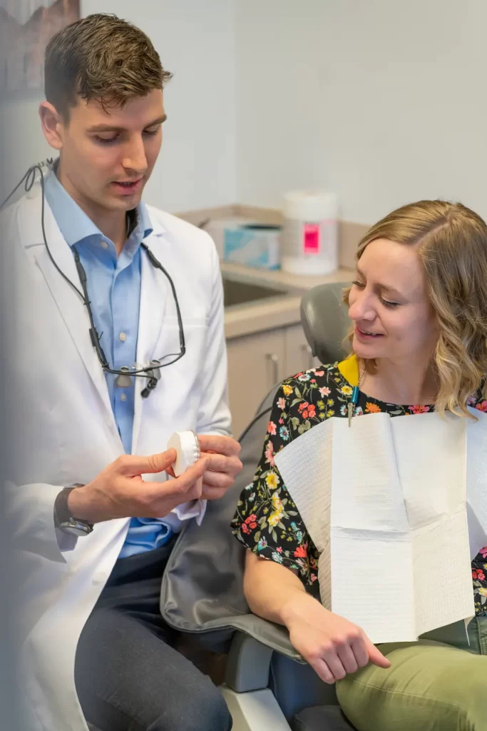 Dr. Robert Geis discussing treatment options with patient .